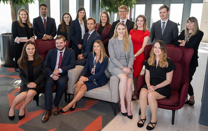 a group of trainees from our summer placement scheme gathered in the vista lounge of Hugh James' 2 Central Square Cardiff office